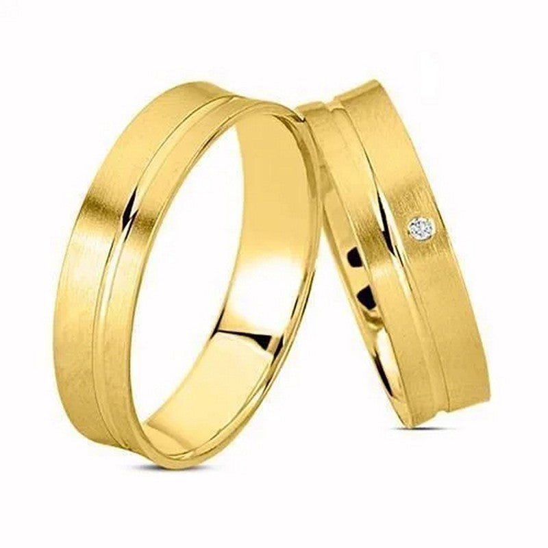 Eksklusiv Nuran vielsesringe i 8 eller 14 karat guld med 0,01 ct diamant, 5 mm brede med blank og silkemat overflade.